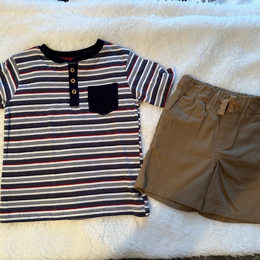Brand new. Never worn. We removed tags but shirts still has the plastic loop.